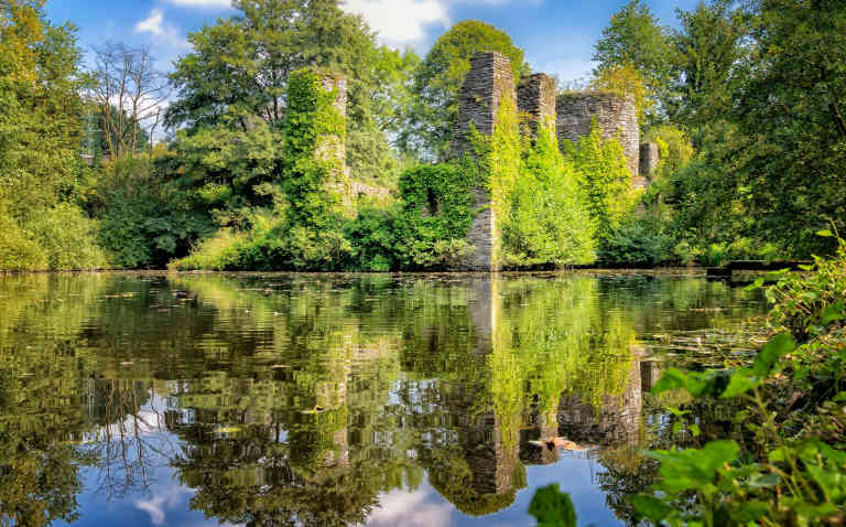 Romantic ruined castle and moat